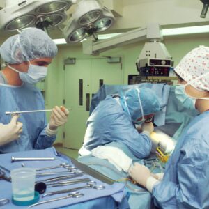 AngioDynamics earnings story illustrated by a surgical team using medical instruments in an operating room.