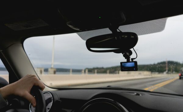 Driver using an advanced vehicle system on a highway, illustrating Mobileye autonomous-driving technology