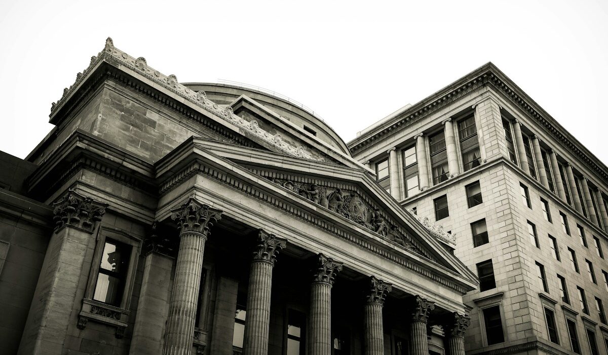 Classical bank building representing Federal Reserve examination rules for smaller banks