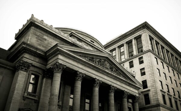 Classical bank building representing Federal Reserve examination rules for smaller banks