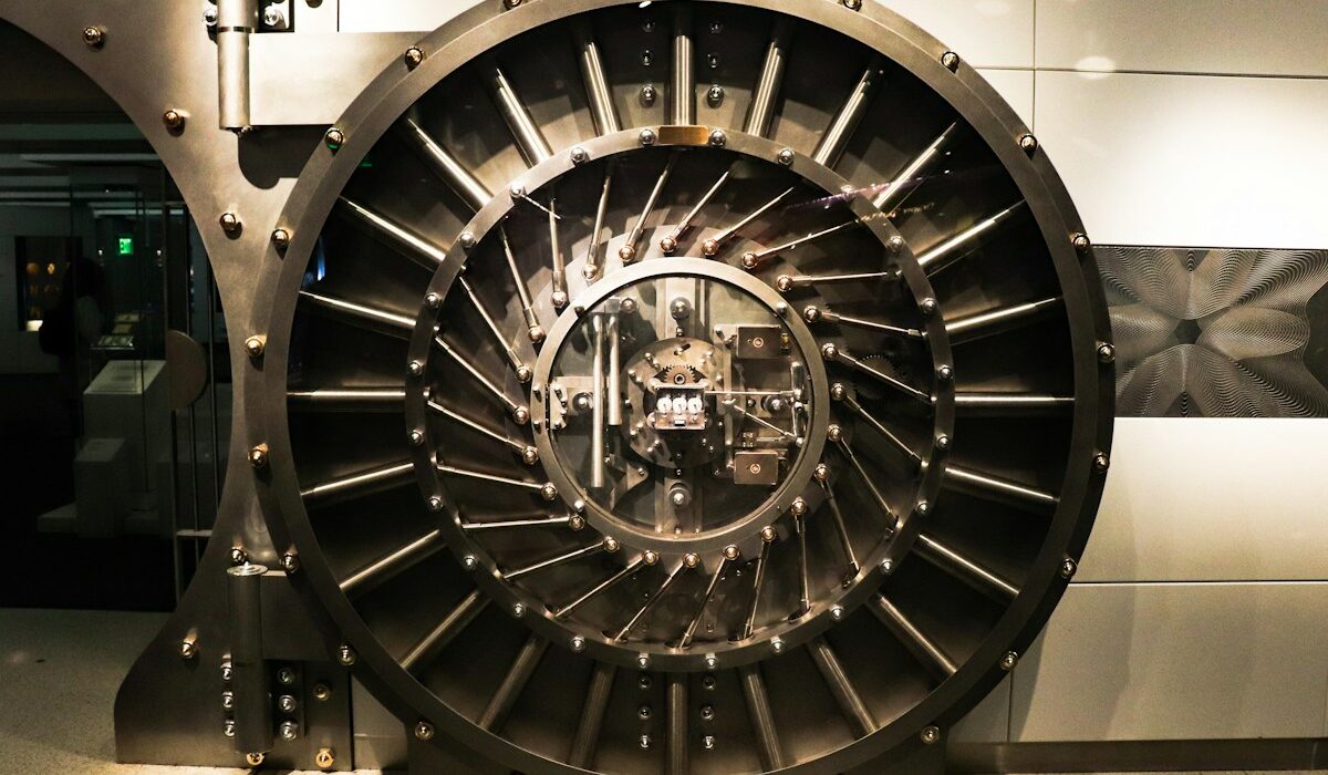 Bank failure backstops illustrated by a large steel bank vault door used to secure financial assets.