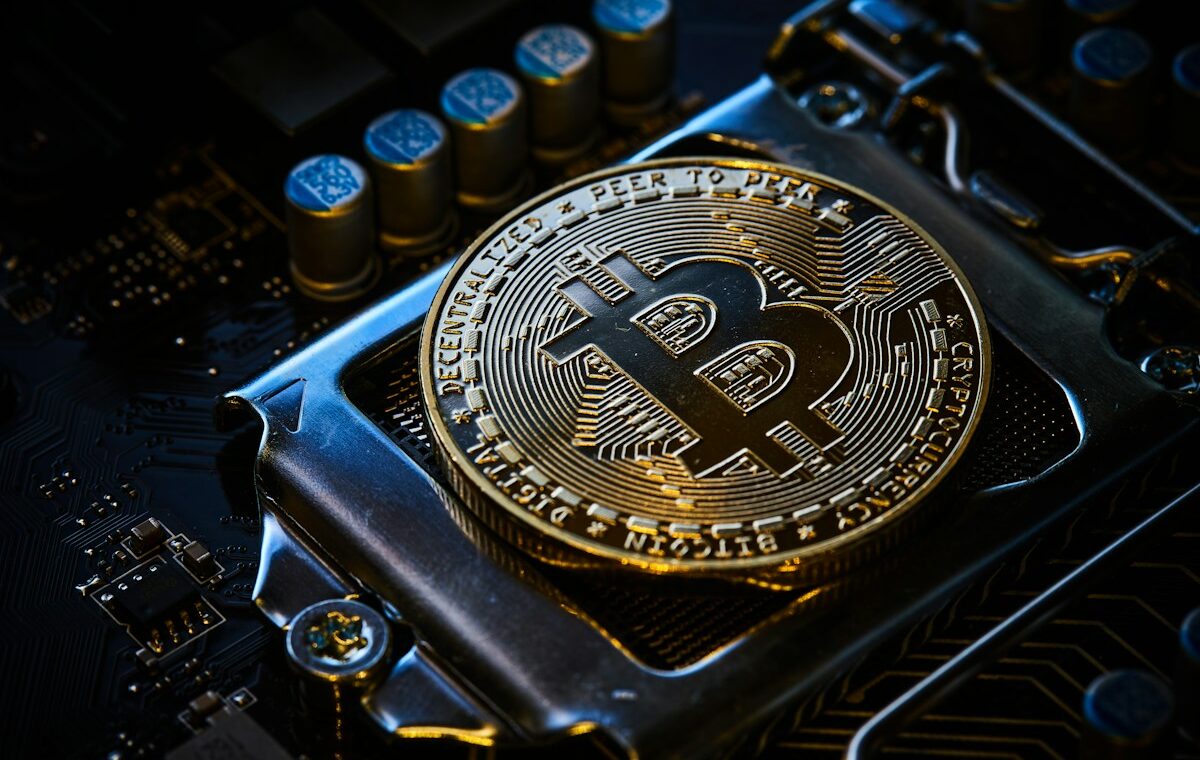 Bitcoin transaction fees represented by a Bitcoin coin on computer hardware