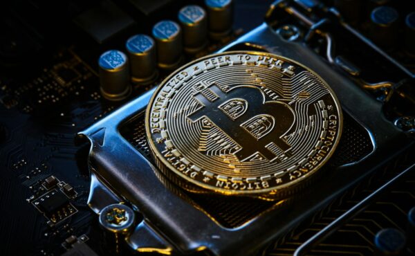 Bitcoin transaction fees represented by a Bitcoin coin on computer hardware