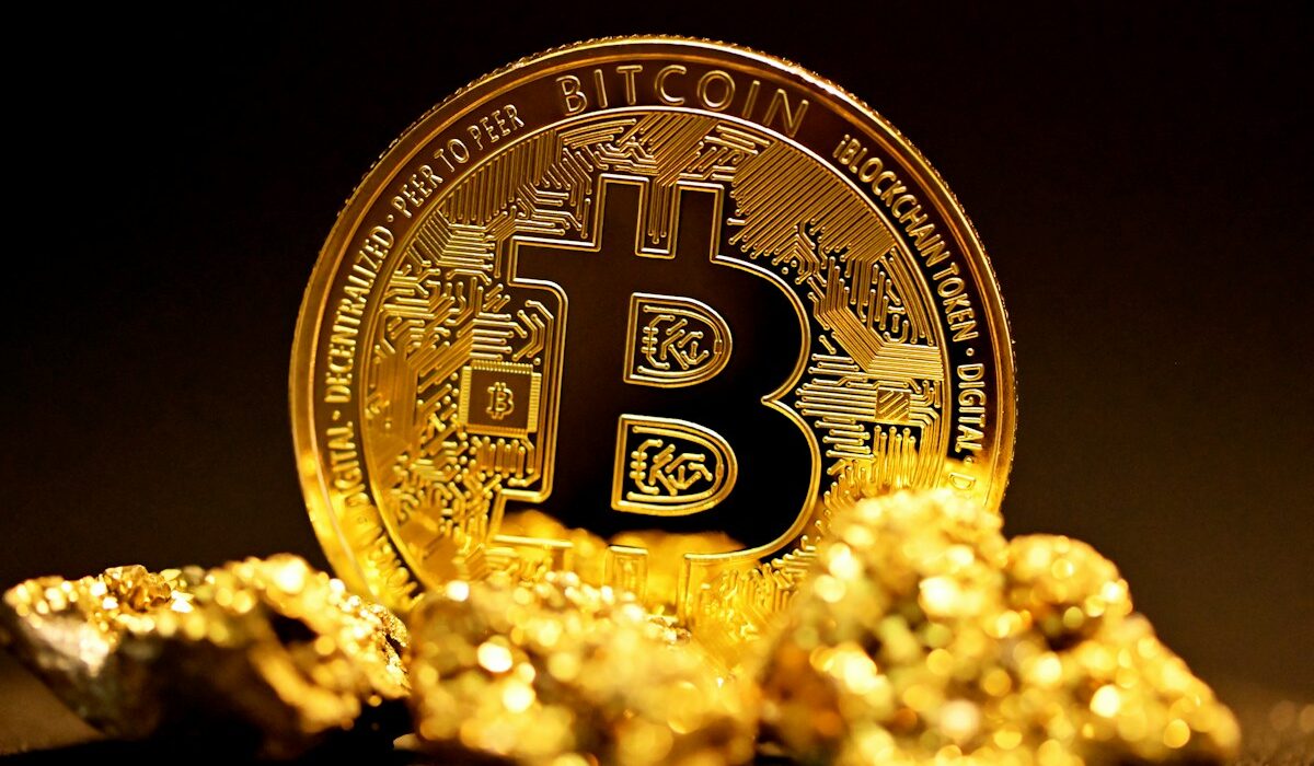 Physical Bitcoin coin illustrating the Bitcoin price outlook near $83,000