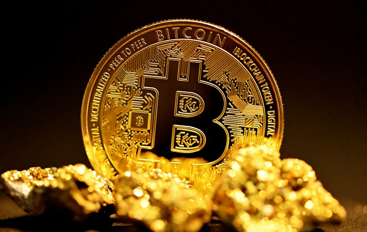 Physical Bitcoin coin illustrating the Bitcoin price outlook near $83,000