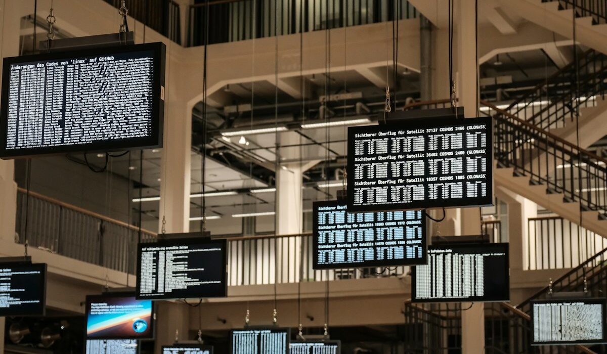Operations center display screens representing Booz Allen defense technology services