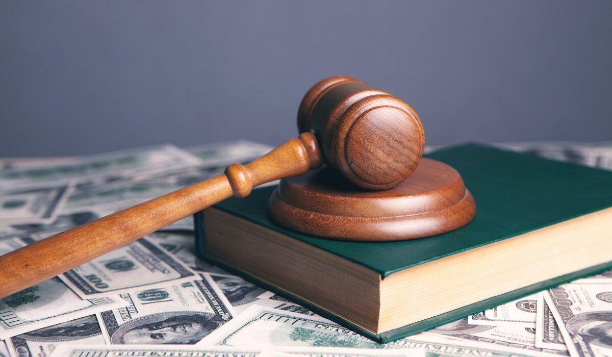 Judge’s gavel and dollar bills representing the CFTC EminiFX judgment
