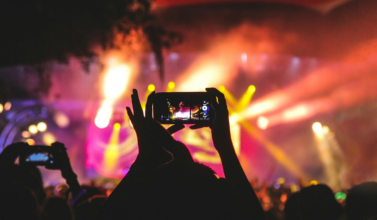 Concert audience member recording a live event on a smartphone