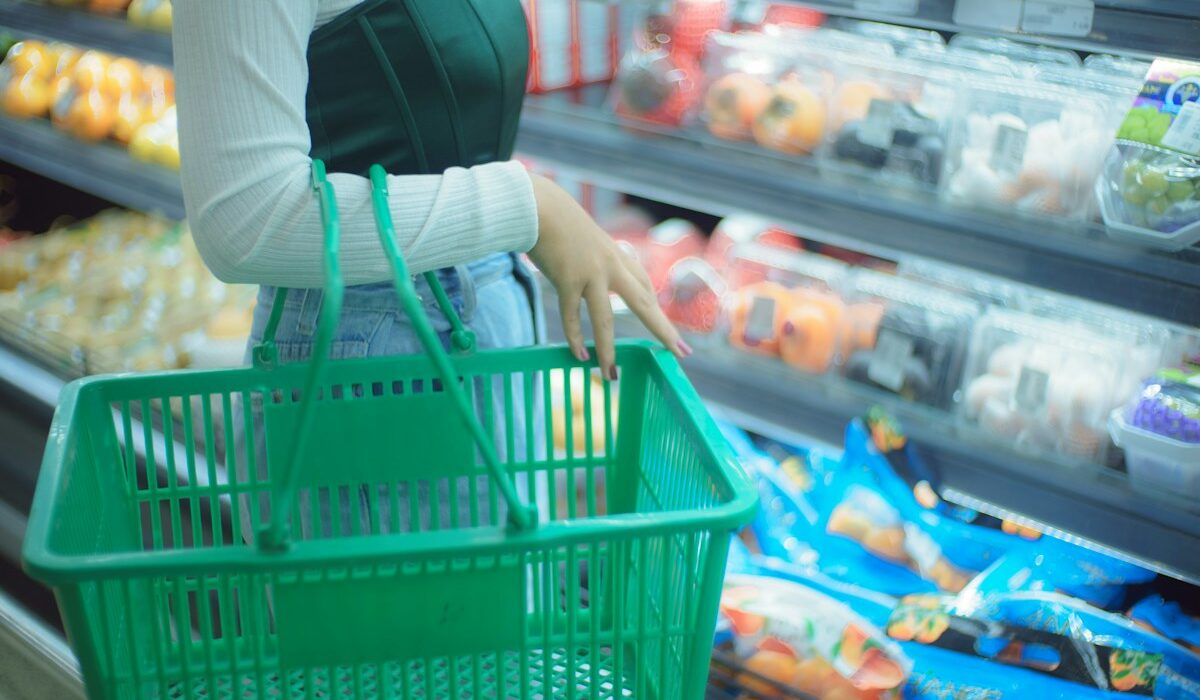 Consumer Price Index represented by a shopper carrying a grocery basket