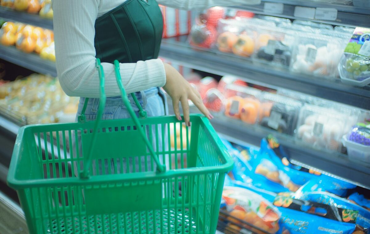 Consumer Price Index represented by a shopper carrying a grocery basket