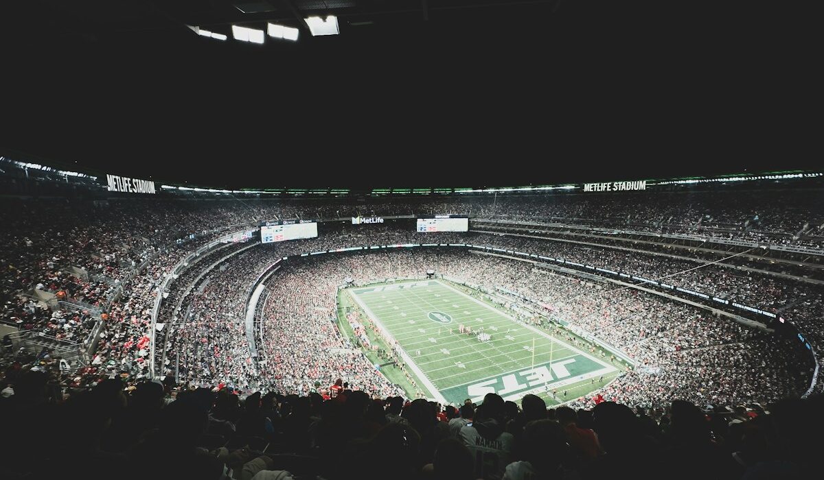 A packed football stadium illustrating the CFTC event contracts proposal. Photo by Myron Mott on Unsplash.