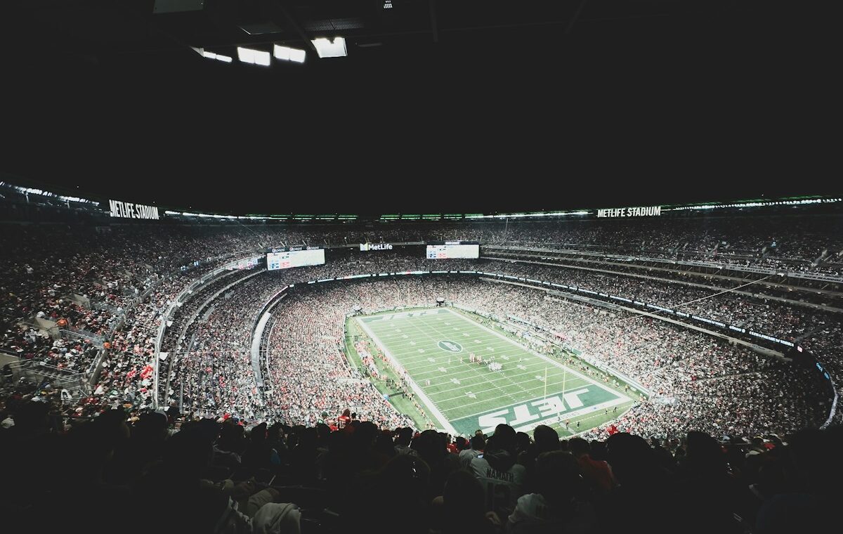 A packed football stadium illustrating the CFTC event contracts proposal. Photo by Myron Mott on Unsplash.