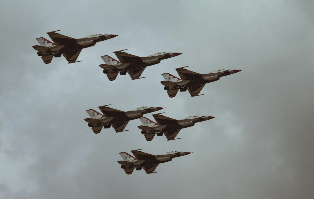 Military jets flying in formation for a defense stocks earnings outlook