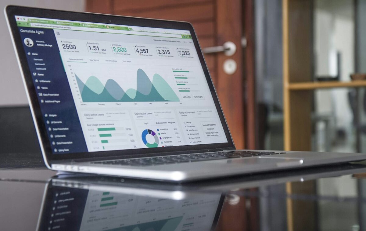 Laptop analytics dashboard representing digital advertising competition
