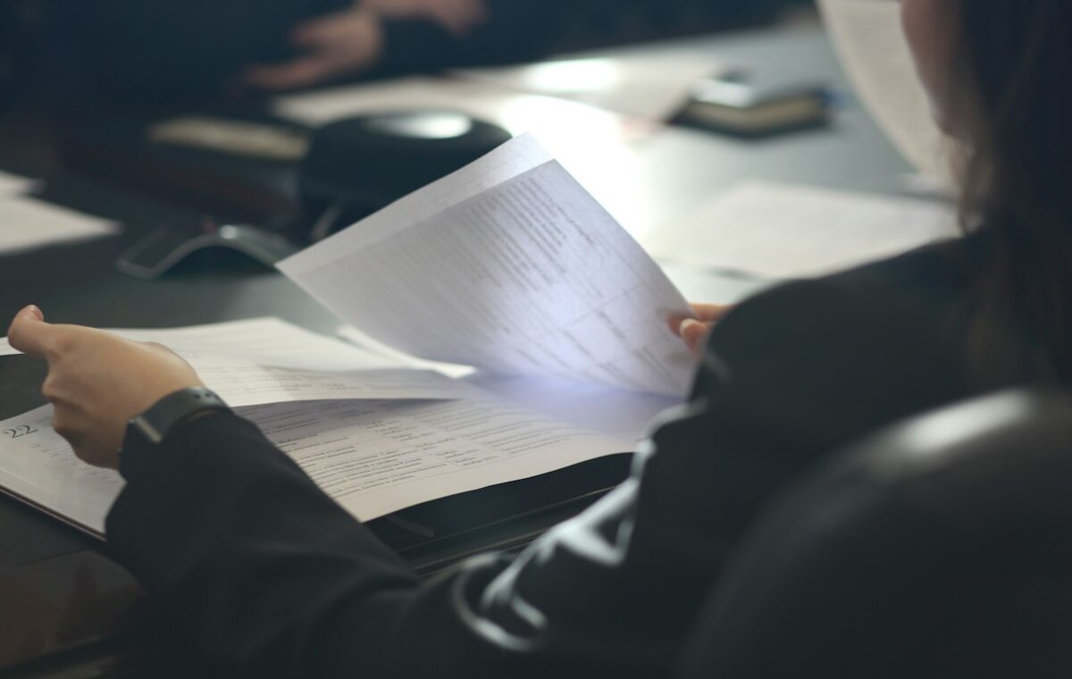 ETF creation and redemption represented by an investor reviewing fund documents