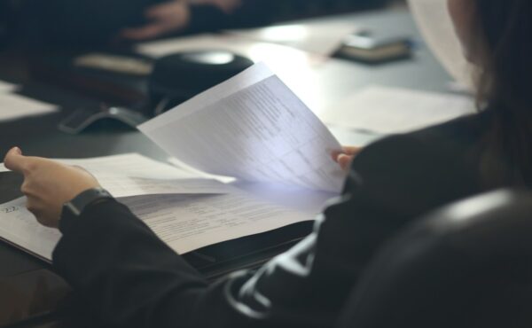 ETF creation and redemption represented by an investor reviewing fund documents