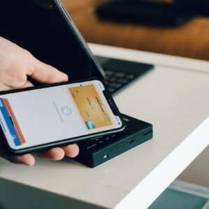 A smartphone using an embedded digital wallet at a payment terminal