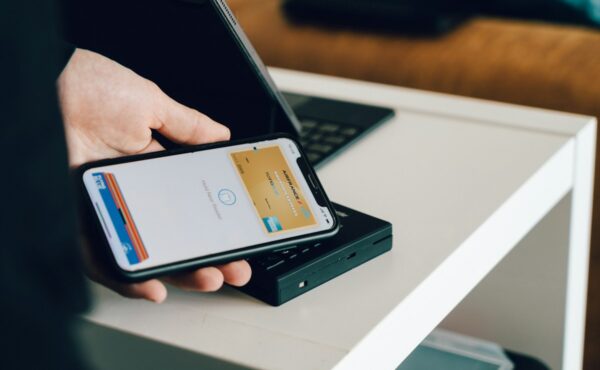 A smartphone using an embedded digital wallet at a payment terminal