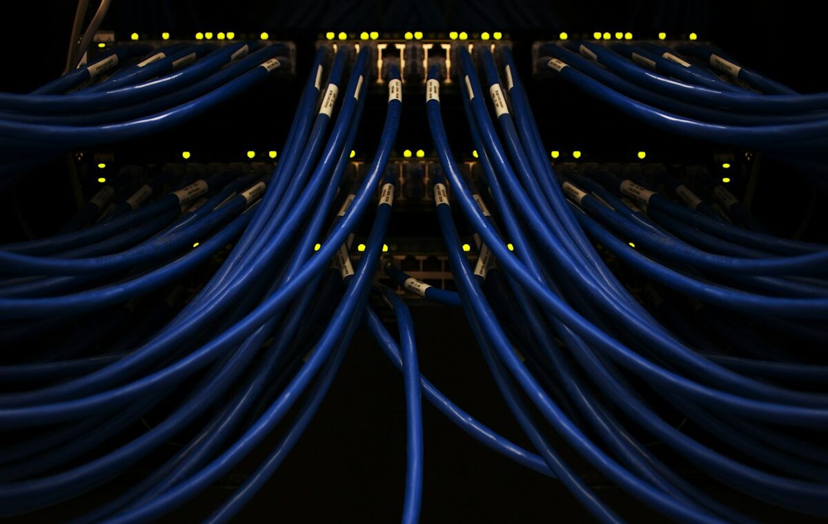 Blue network cables connected to data-center equipment, representing Nokia AI and cloud infrastructure