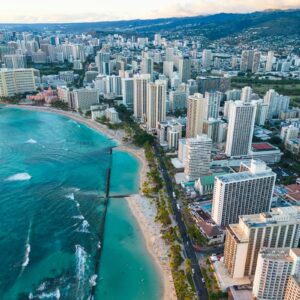Aerial view of Honolulu coastline and city buildings representing First Hawaiian's home market