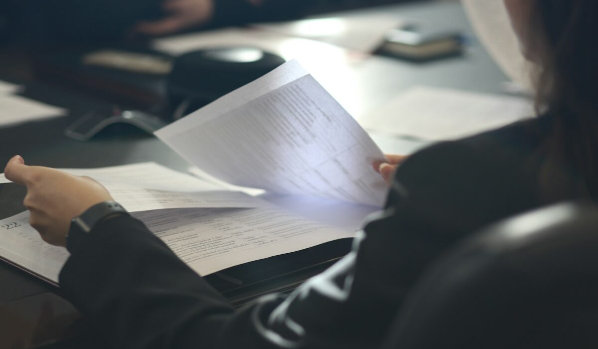 Fund manager reviewing documents for the SEC cross-trading rule proposal