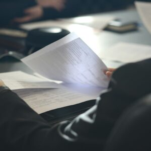 Fund manager reviewing documents for the SEC cross-trading rule proposal