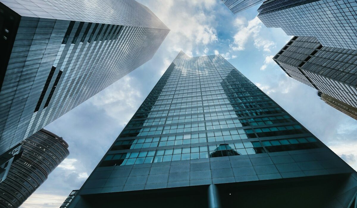 Bank headquarters representing Basel AML supervision and AI transaction monitoring