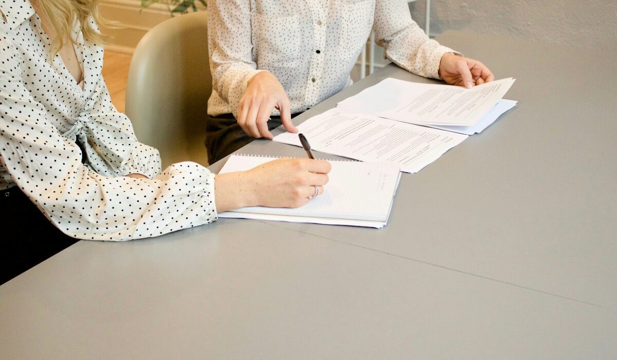Client signing financial planning documents representing Globe Life insurance