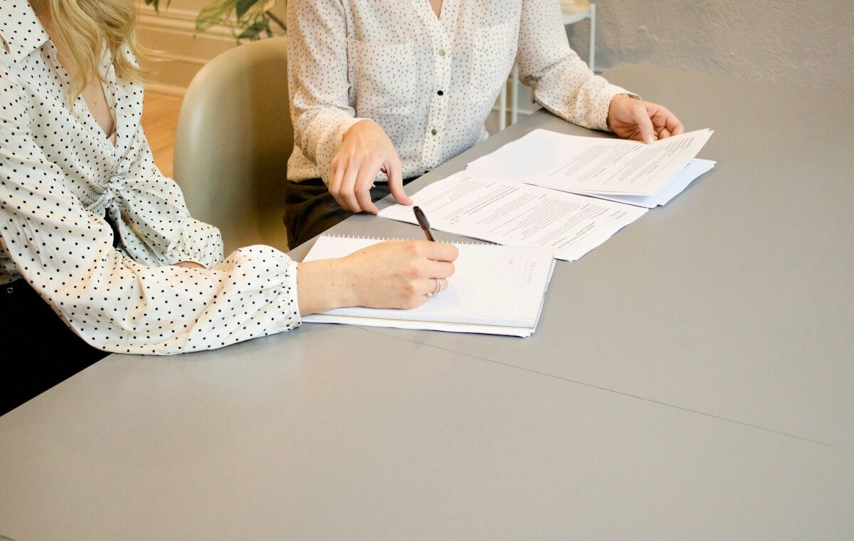 Client signing financial planning documents representing Globe Life insurance