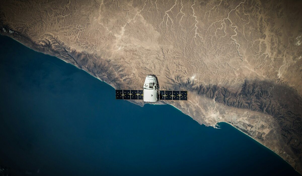 Satellite above Earth representing Google Earth AI geospatial analysis