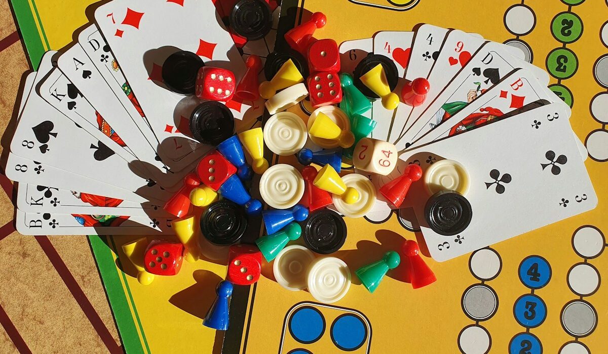 Colorful board game pieces, cards and dice