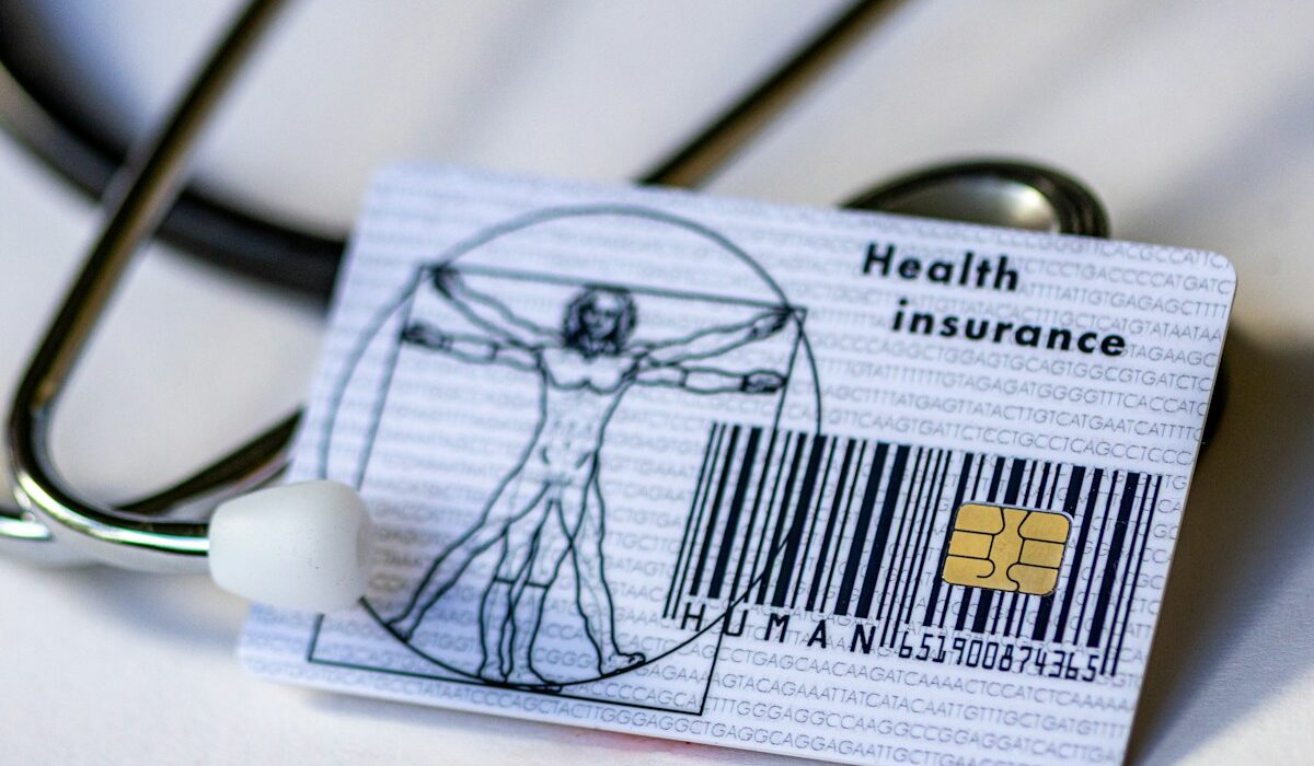 Health insurance card and stethoscope representing Molina Healthcare earnings