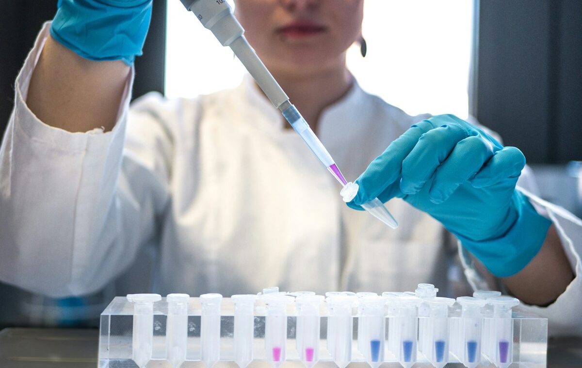 Hepion Gravitas acquisition represented by a scientist conducting laboratory research