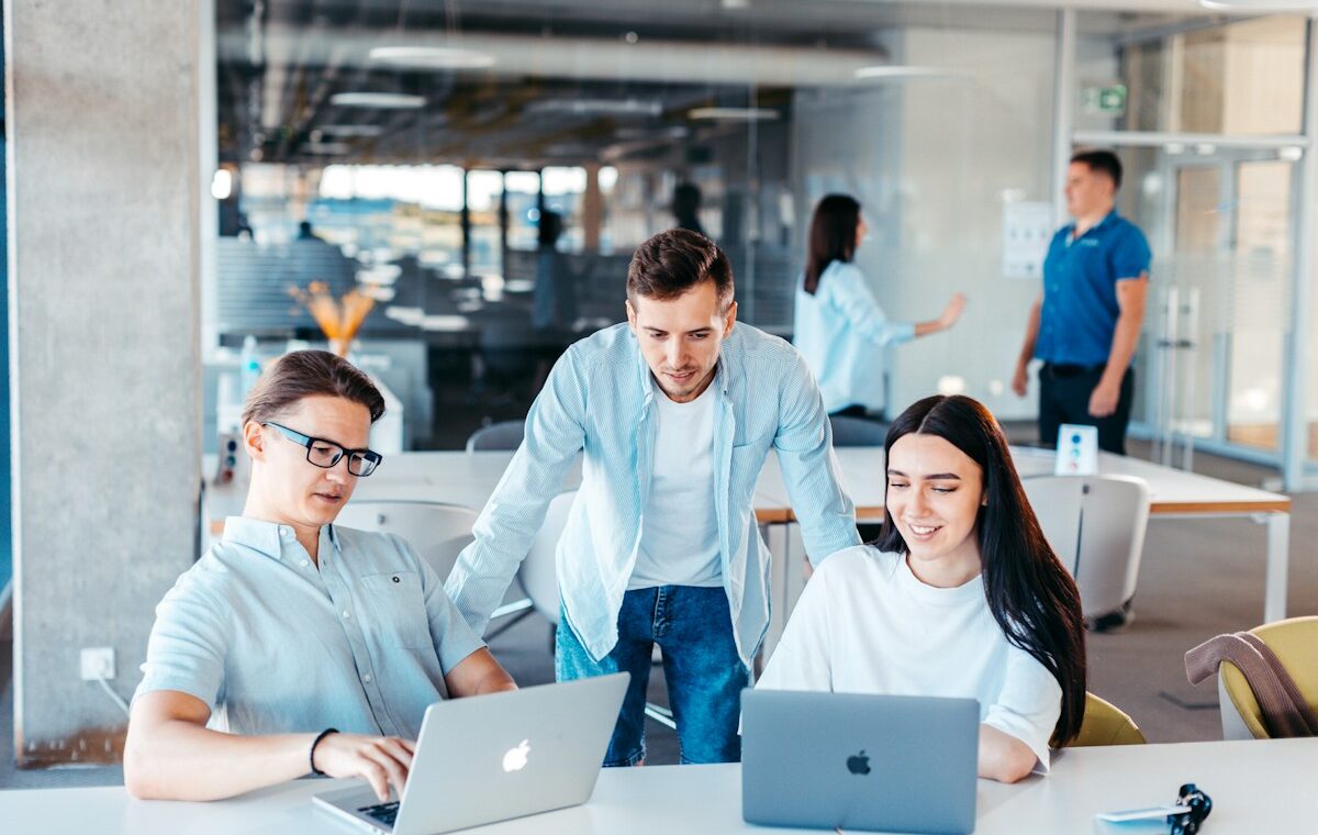 Software professionals collaborating as HubSpot layoffs reshape teams around an AI strategy