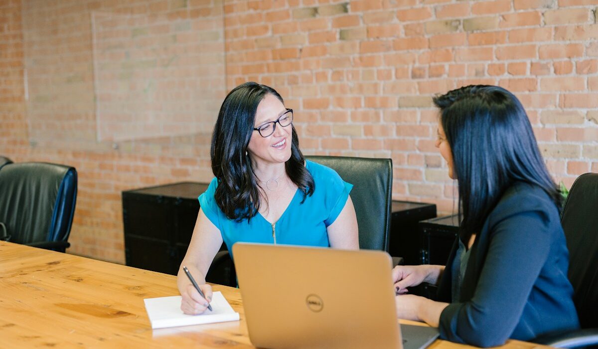 Business leaders meeting around a conference table to review AI governance risks