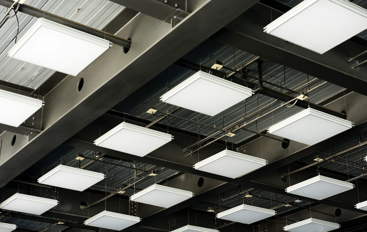 Industrial LED ceiling lights illustrating Signify's lighting business results