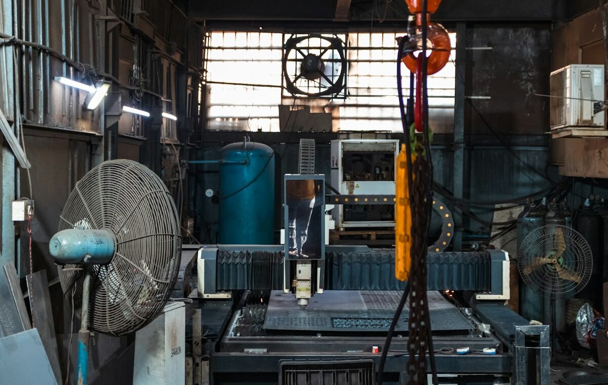 Capital expenditure explained with CNC machinery inside a metal workshop