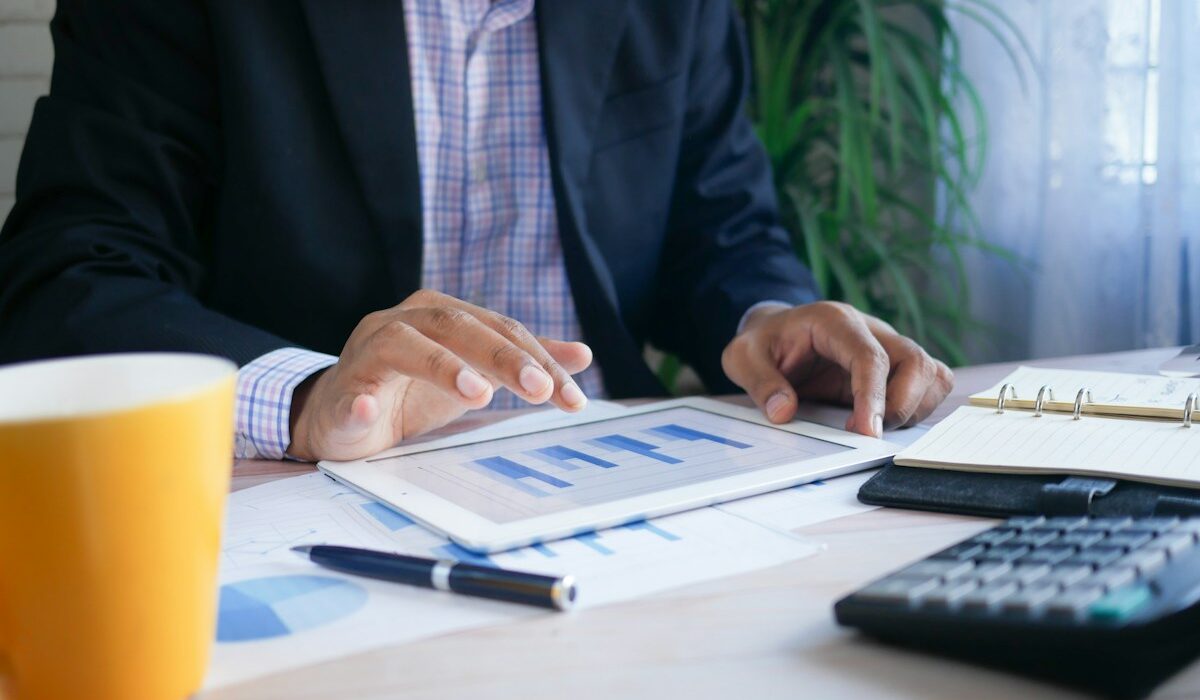 Investment professional reviewing portfolio charts, illustrating WisdomTree assets under management