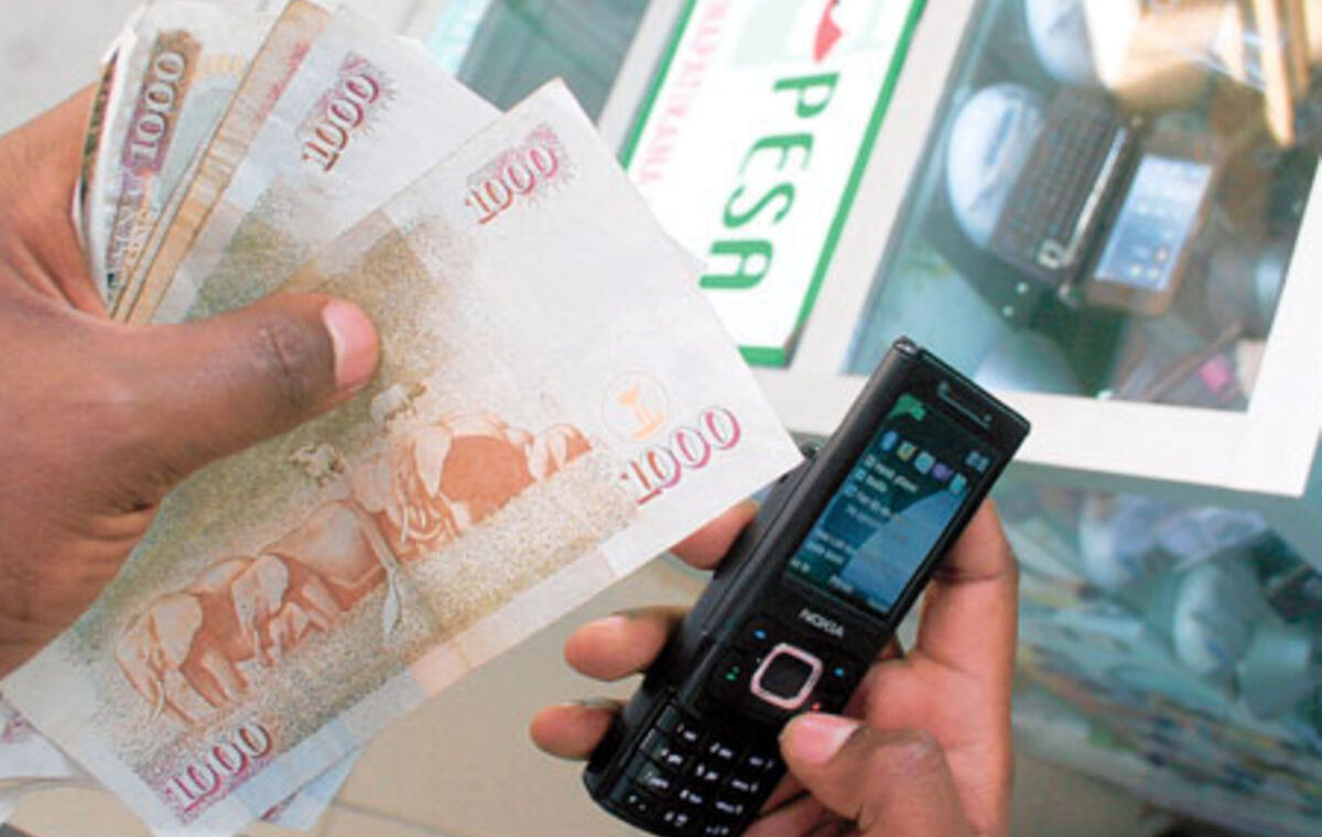 M-Pesa phone and Kenyan currency illustrating the Kenya Payment System Bill