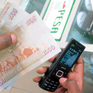 M-Pesa phone and Kenyan currency illustrating the Kenya Payment System Bill