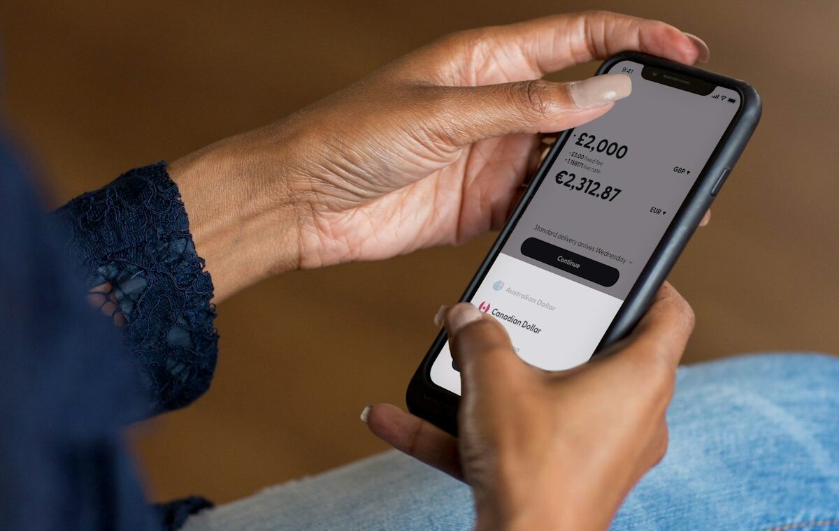 Person using a mobile finance app representing Cleo AI customer refunds