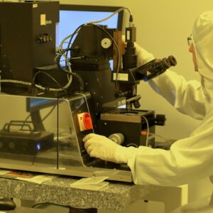 Engineer operating semiconductor equipment in an NVIDIA AI-defined fab cleanroom