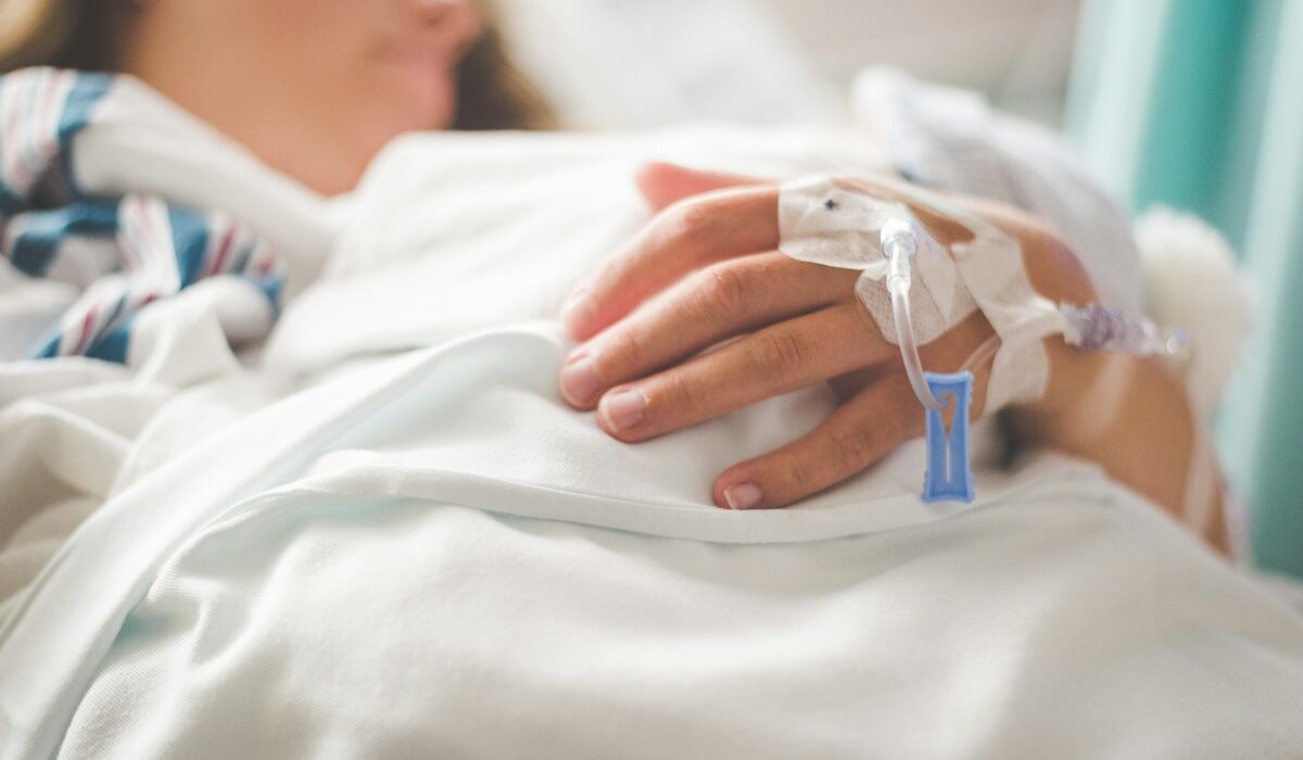 Option Care Health acquisition represented by a patient receiving an intravenous infusion