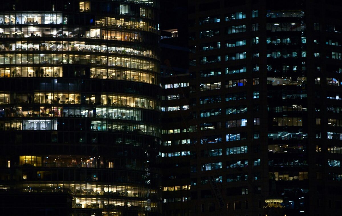 Illuminated financial-district offices representing the overnight federal funds rate market