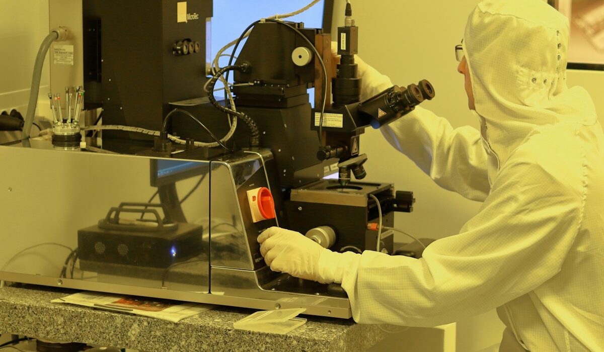 Semiconductor engineer in a cleanroom representing the completed Skyworks Qorvo merger