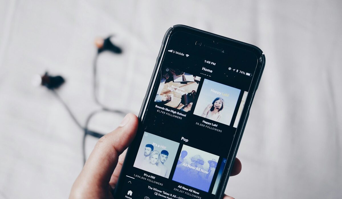 Smartphone displaying a music streaming app for Spotify Q3 2026 results
