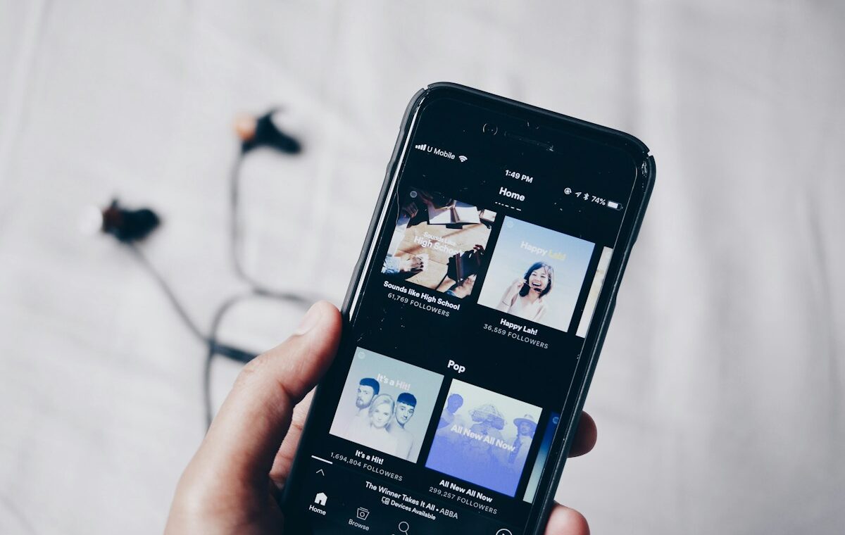 Smartphone displaying a music streaming app for Spotify Q3 2026 results