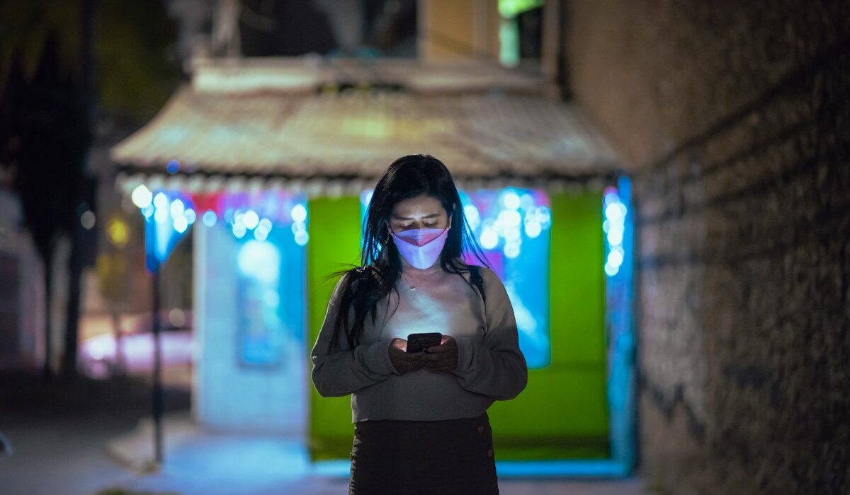Smartphone user representing stablecoin payment infrastructure across Latin America