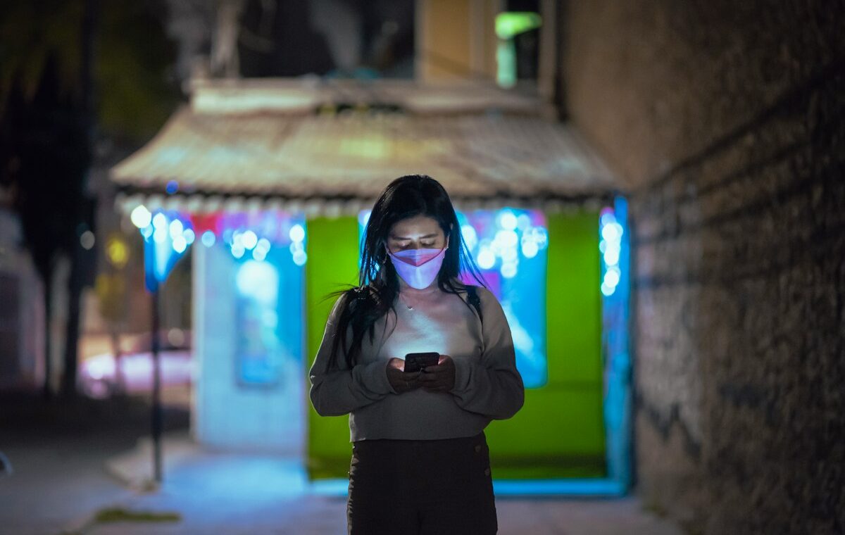 Smartphone user representing stablecoin payment infrastructure across Latin America
