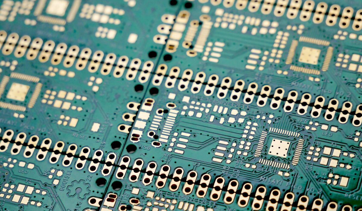 Close-up of semiconductor circuit boards representing Texas Instruments revenue growth